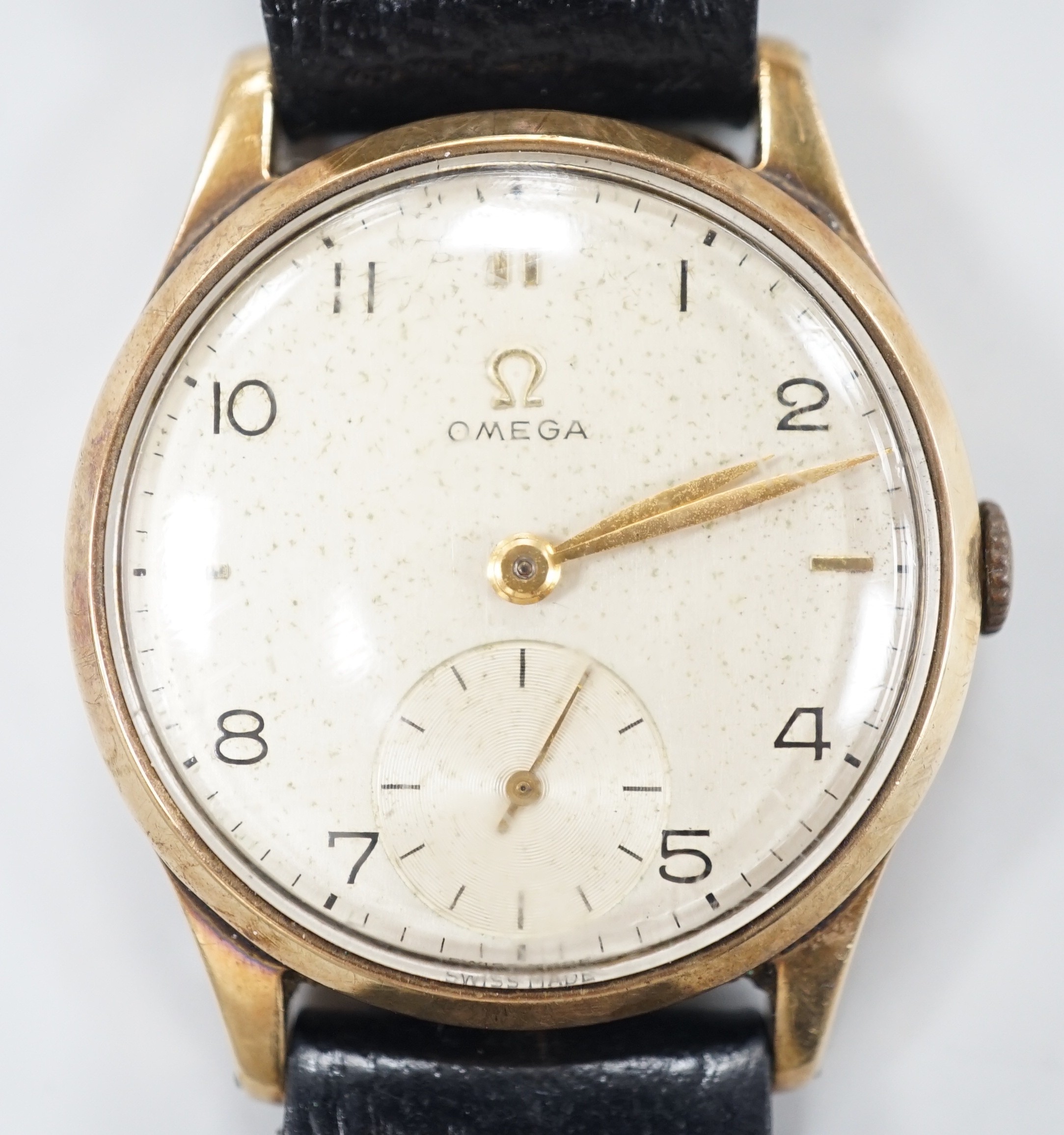 A gentleman's 1950's 9ct gold Omega manual wind wrist watch, movement c.265, case diameter 34mm, on later associated leather strap.